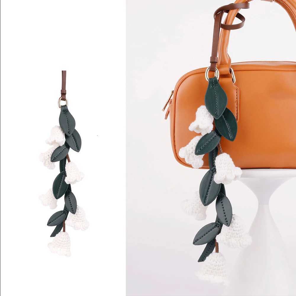 Luxury White lily of the valley bag charm handmade Cowhide woven flower pendant knitted highend Flower Shaped bag accessories Y250928