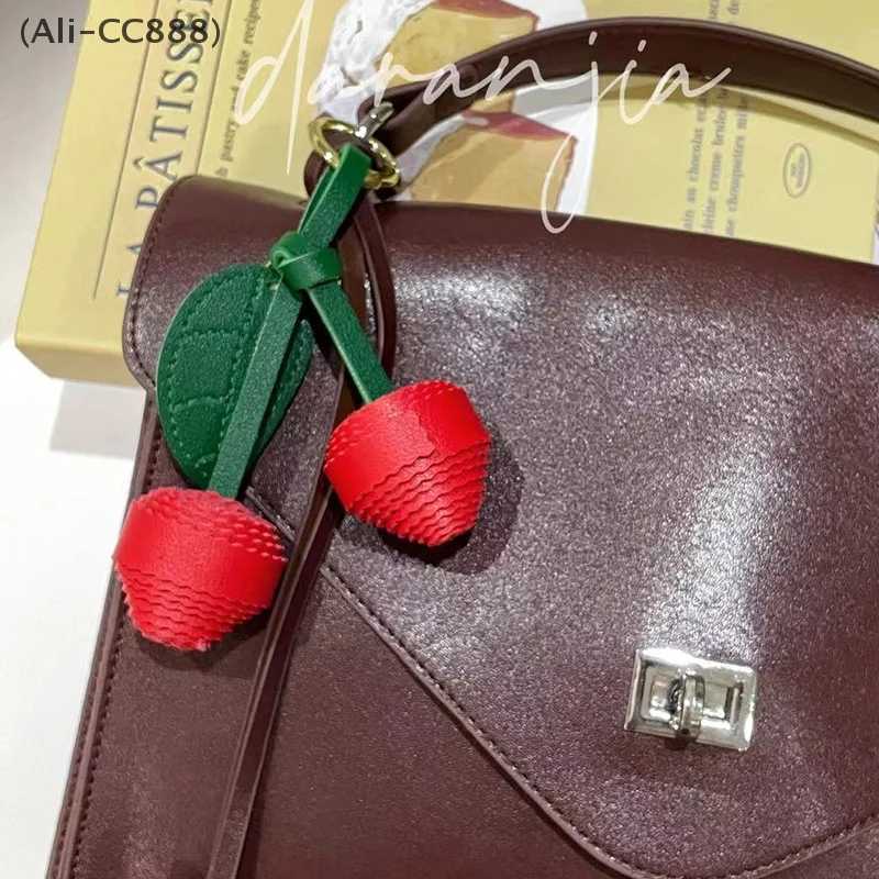 Luxury CC88New Leather Leaf Exquisite Cherry Braided Ball Bag Pendant Keychain Womens Bag Decoration Accessories Y250928as