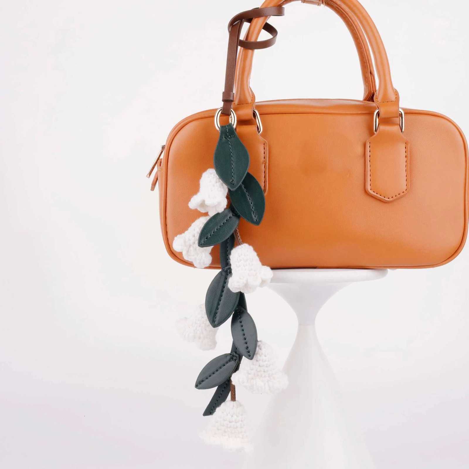 Luxury White lily of the valley bag charm handmade Cowhide woven flower pendant knitted highend Flower Shaped bag accessories Y250928as