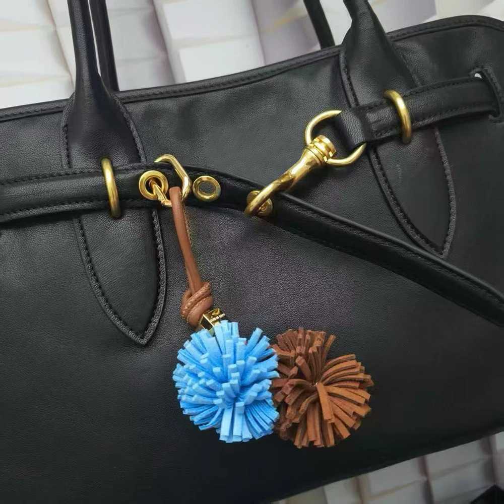 Luxury Flower Ball Leather Pendant Cowhide Rope Bags Luxury Design Charm Keychain Car Pendant For Woman Bag Accessories Handbag Y250928