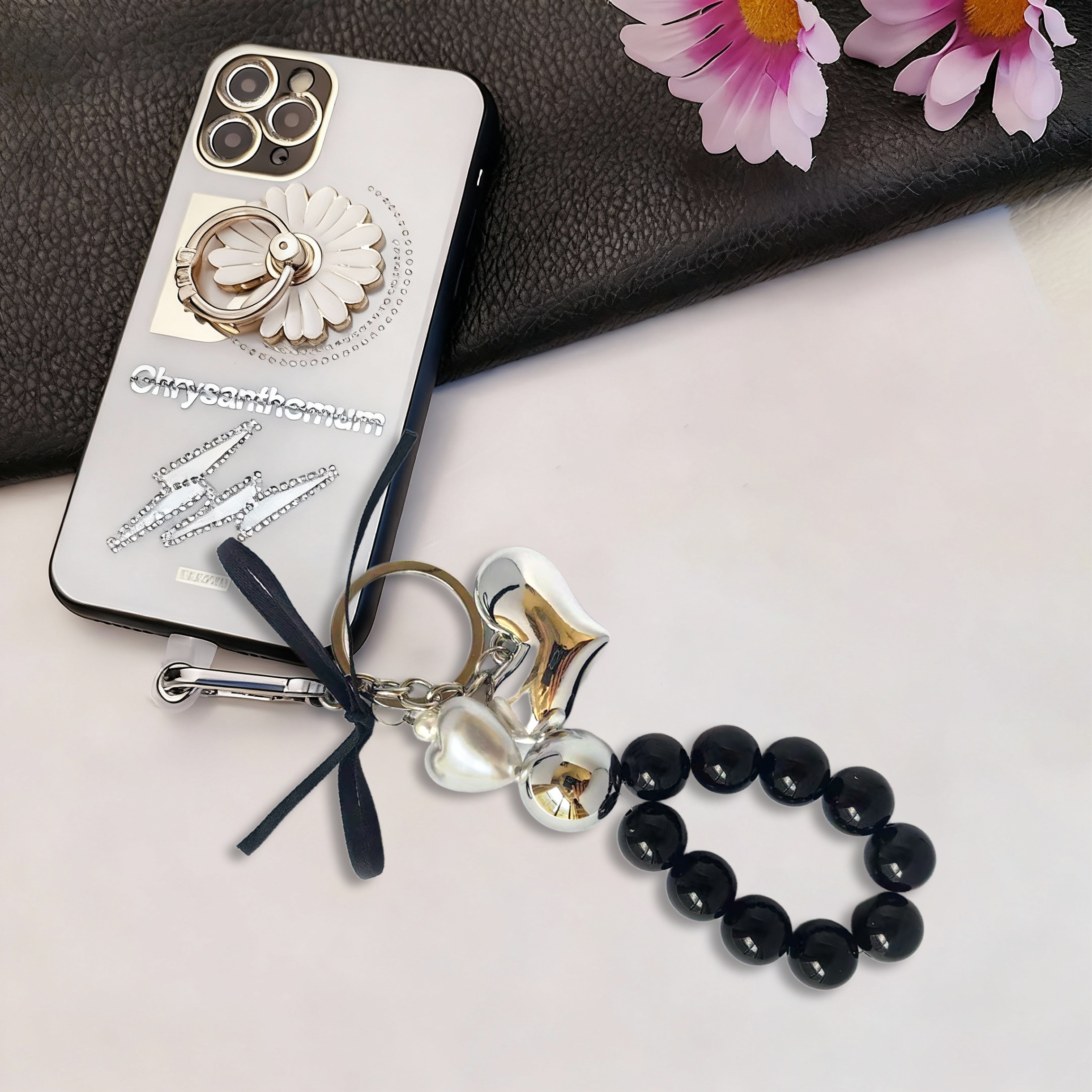 Fashion-forward phone charm, metal heart design, metallic pearls, black pearl strand, trendy accessory, anti-loss feature, easy to carry