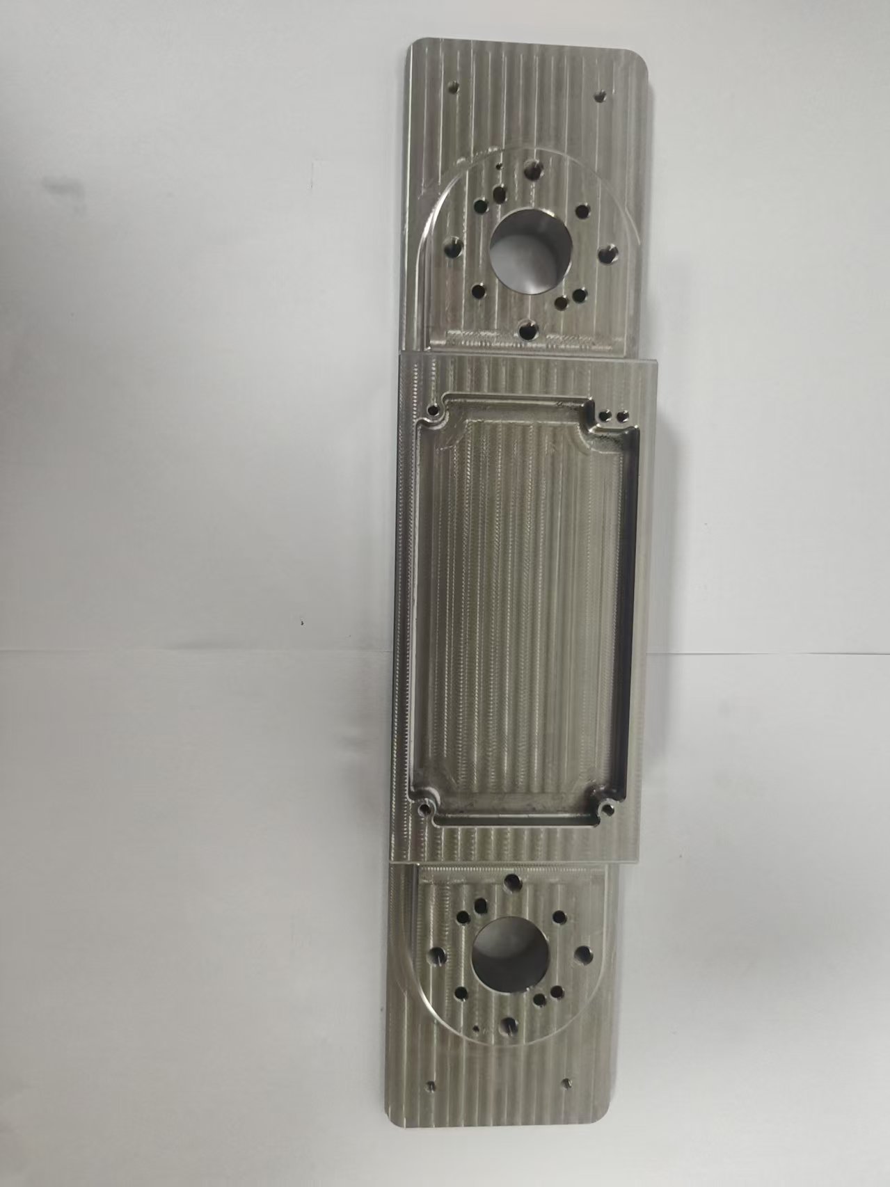 Common Tools Precision - Machined Stainless Steel Mechanical Component with Dual Circular Interfaces and Ribbed Structure H04