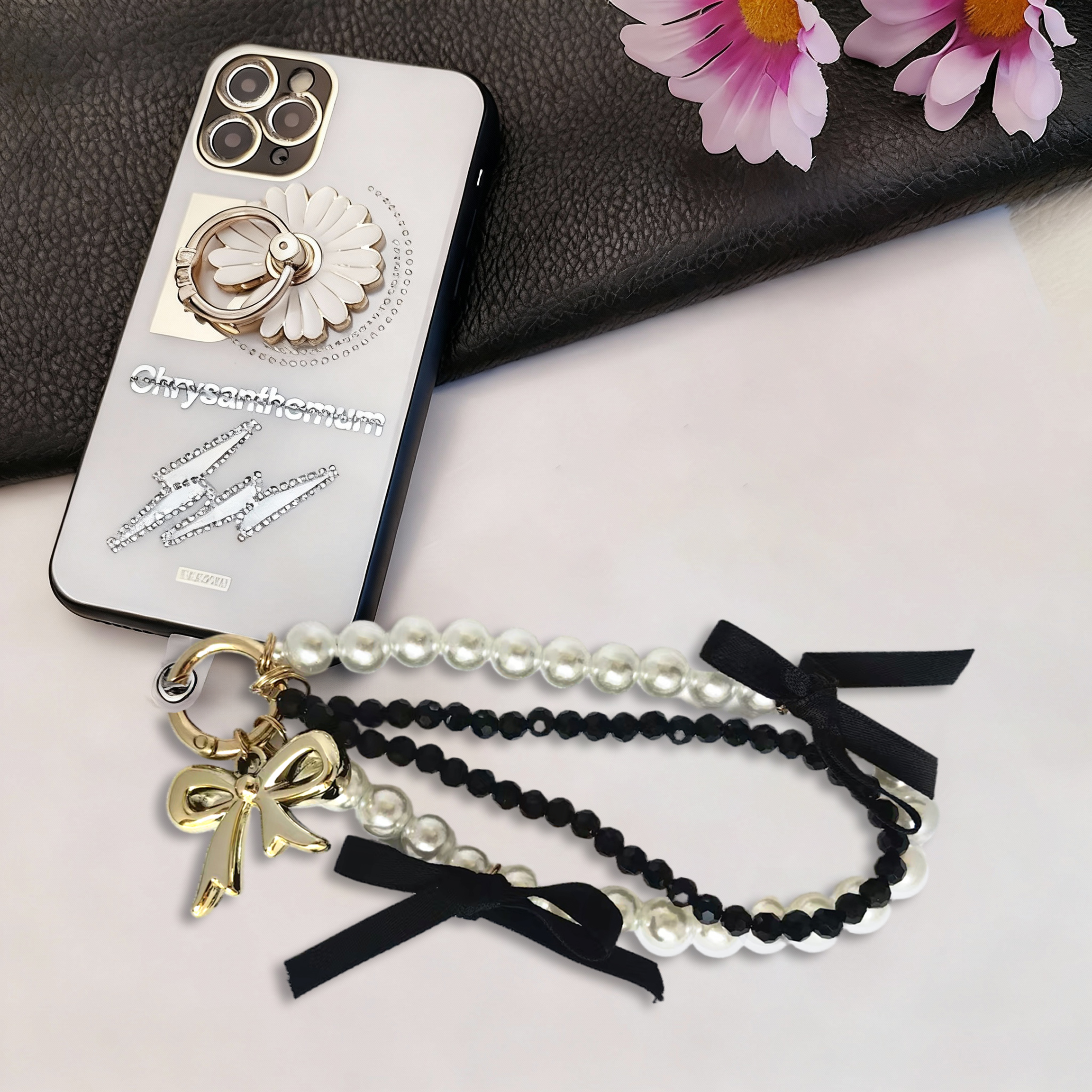 White pearl bracelet, black diamond bracelet, gold bow, black ribbon bow phone strap. Stylish pairing, creative design, anti-loss, easy to grab.