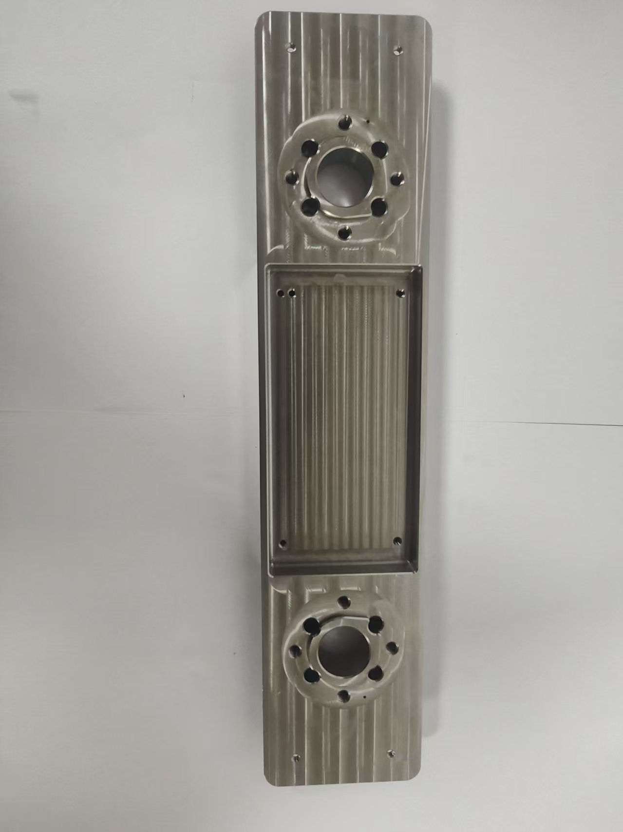 Common Tools Precision - Machined Stainless Steel Mechanical Component with Dual Circular Interfaces and Ribbed Structure H04