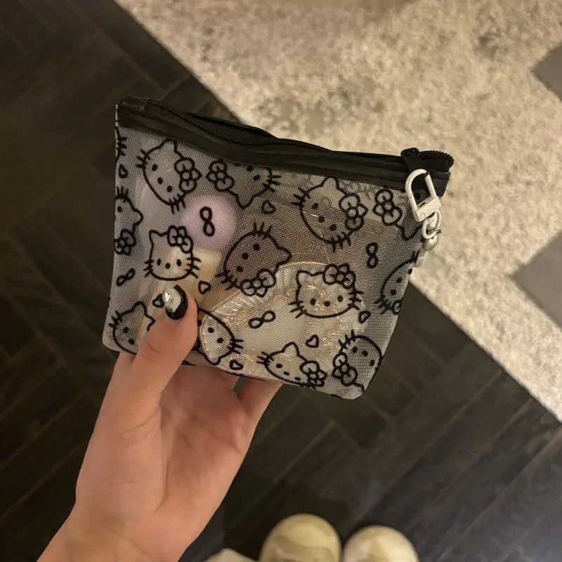 Sanrio New 2025 Hello Kitty Mesh Material Storage Bag Portable Zipper Coin Purse Creative Earphone Bag Cute Girls Cosmetic Bag L250929