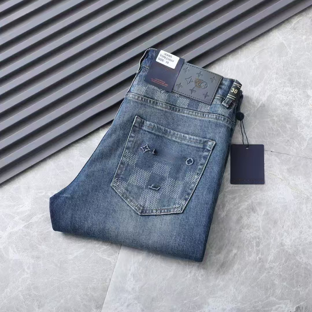 Just Released Designer high end brand mens slim fit small straight leg lvs jeans made from stretch fabric available in boutiques Wash Technique