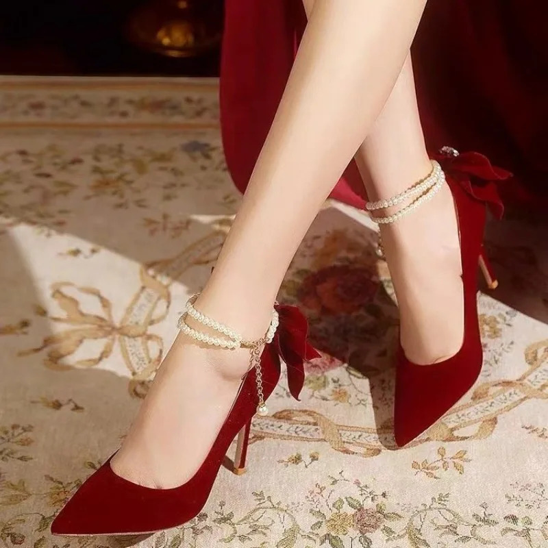 Red Xiuhe wedding shoes pointy stiletto high heels female shallow mouth bow pearl one word buckle strap two wear bride shoes 250103