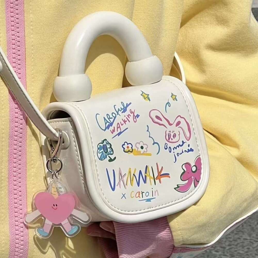 2025S Designer S New Model Mini Cute And Fashionable Cartoon Graffiti For Women Spring Summer New Korean Edition Student Crossbody Tote Bag Tide