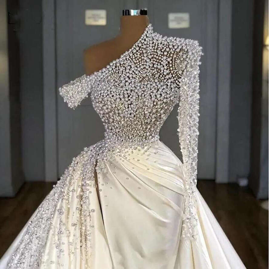 2023 Sexy Dubai Mermaid Wedding Dresses Illusion Pearls Beadings One Shoulder Satin Long Sleeve Overskirts Plus Size Bridal Gowns Vestidos De Novia