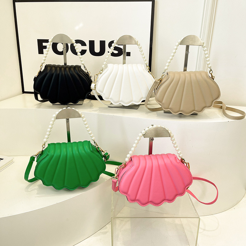 Chic Mini Shell Handbag with Adjustable Chain Straps Compact and Stylish Shoulder Accessory