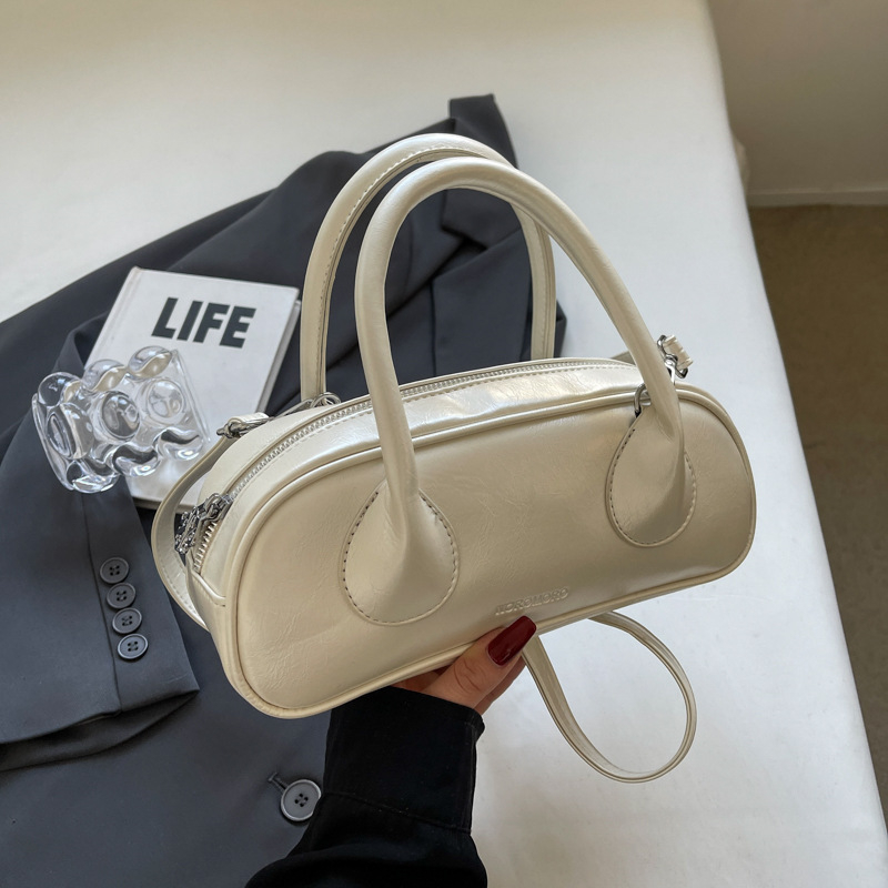 2025 new free shipping designer Single shoulder bag baguette Vintage solid color casual versatile Tote package fashionable women black white pink