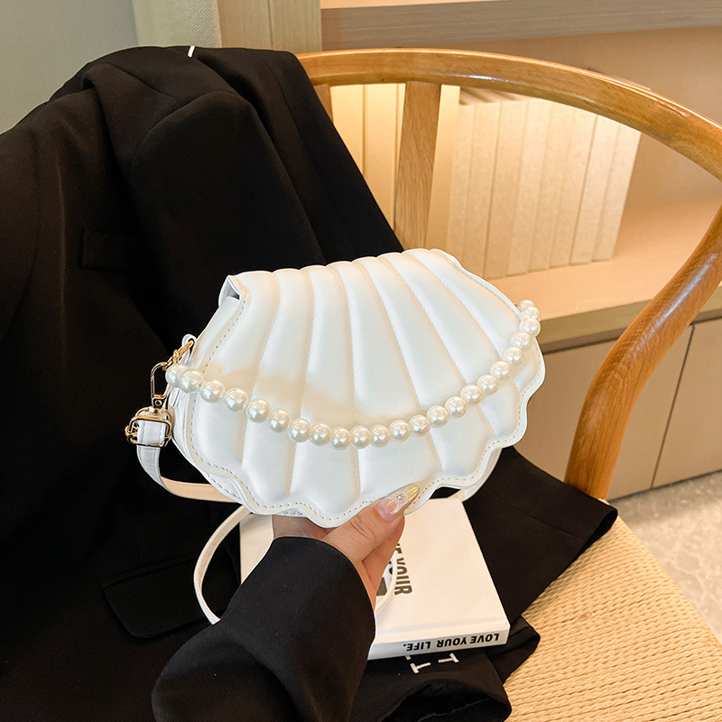 Chic Mini Shell Handbag with Adjustable Chain Straps Compact and Stylish Shoulder Accessory