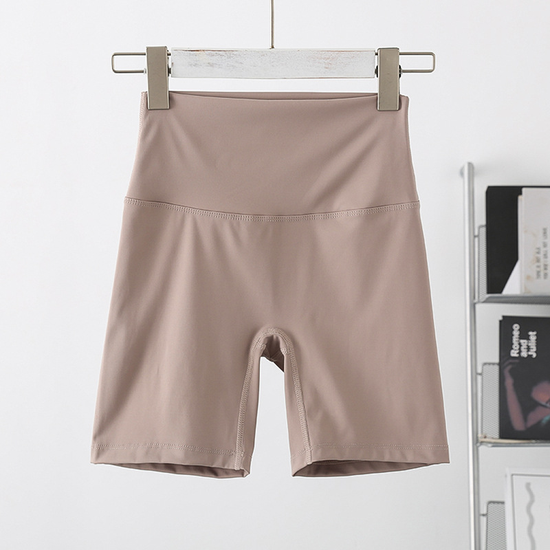 Ladies' high waisted, hip lifting quick drying elastic seamless nude fitness pants with pockets three part pants without awkward lines sports pan