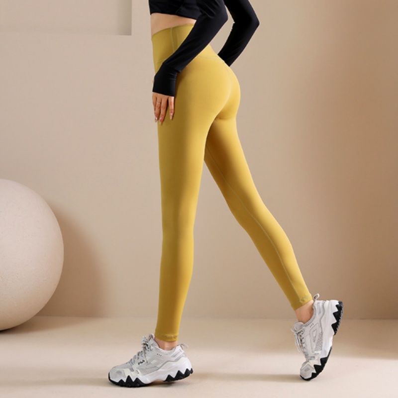 Ladies' high waisted, hip lifting quick drying elastic seamless nude fitness pants with pockets three part pants without awkward lines sports pan