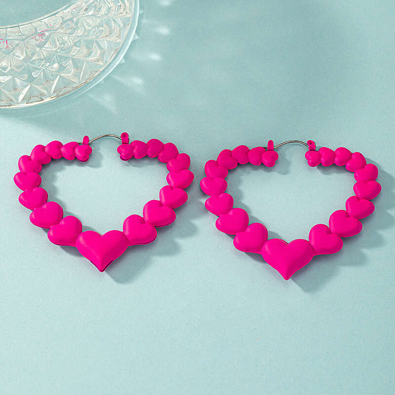 Peach rose red temperament heart exaggerated dragon fruit color niche female design cute earrings