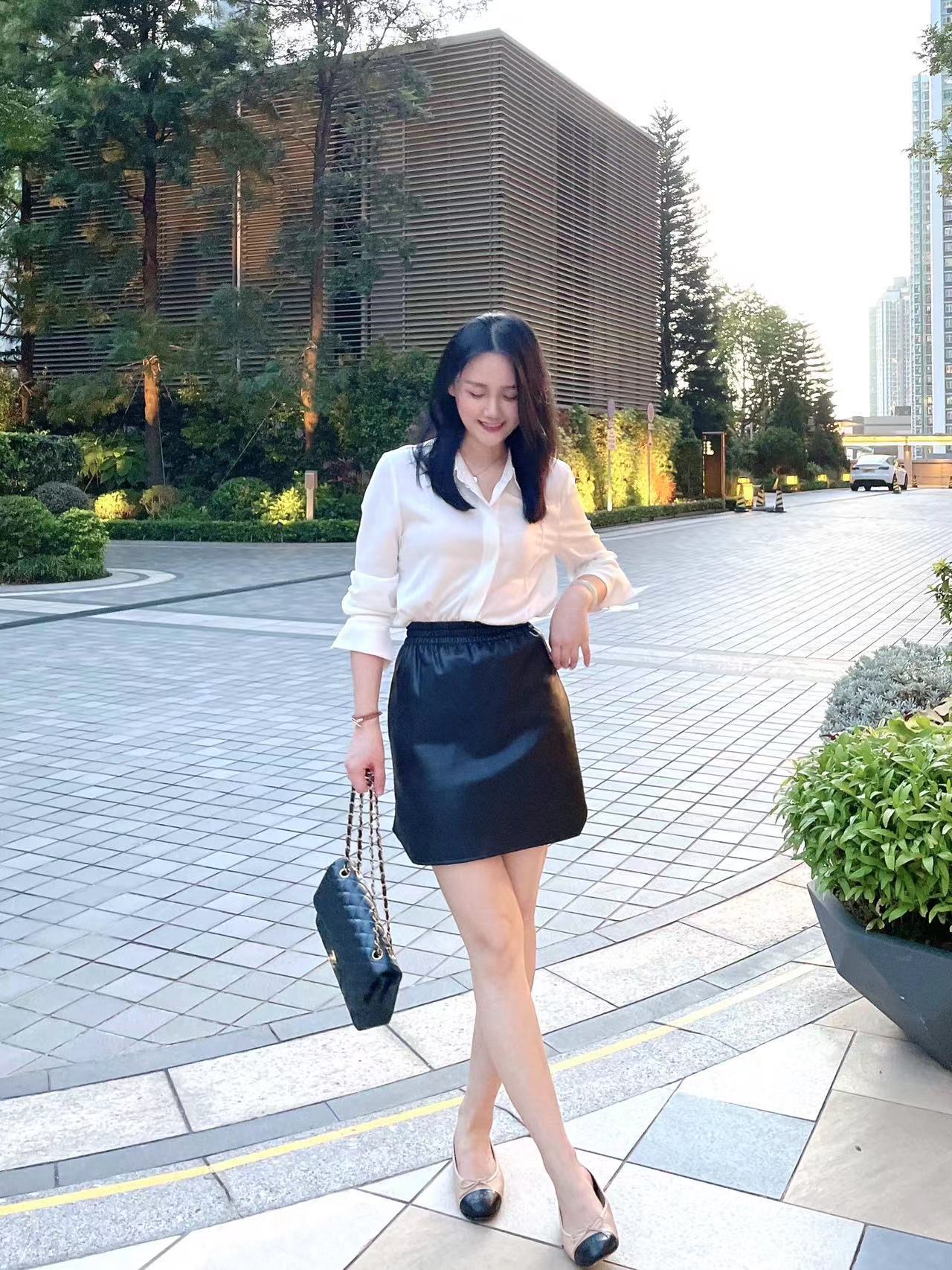 D86890 Winter temperament commuting elastic waist PU leather short skirt loose high skirt female hip skirt
