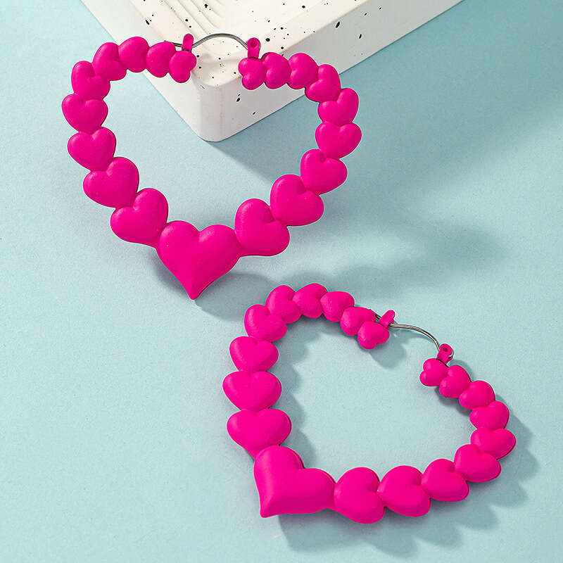 Peach rose red temperament heart exaggerated dragon fruit color niche female design cute earrings