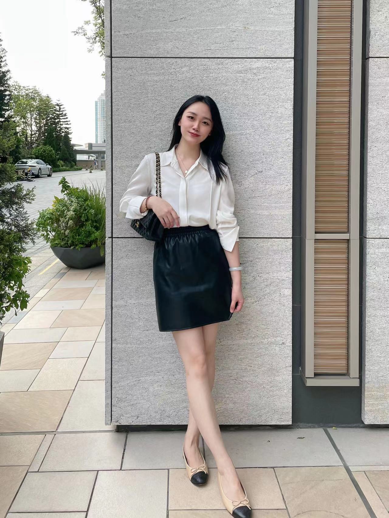 D86890 Winter temperament commuting elastic waist PU leather short skirt loose high skirt female hip skirt