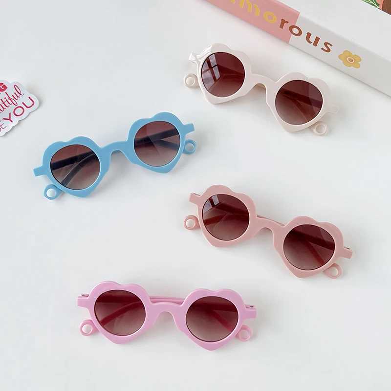 2024 Cute Heart shaped Hollow Sunglasses for Girls and Boys UV400 Childrens Fashion Outdoor Sunscreen Glasses Childrens Sunglasses W250109