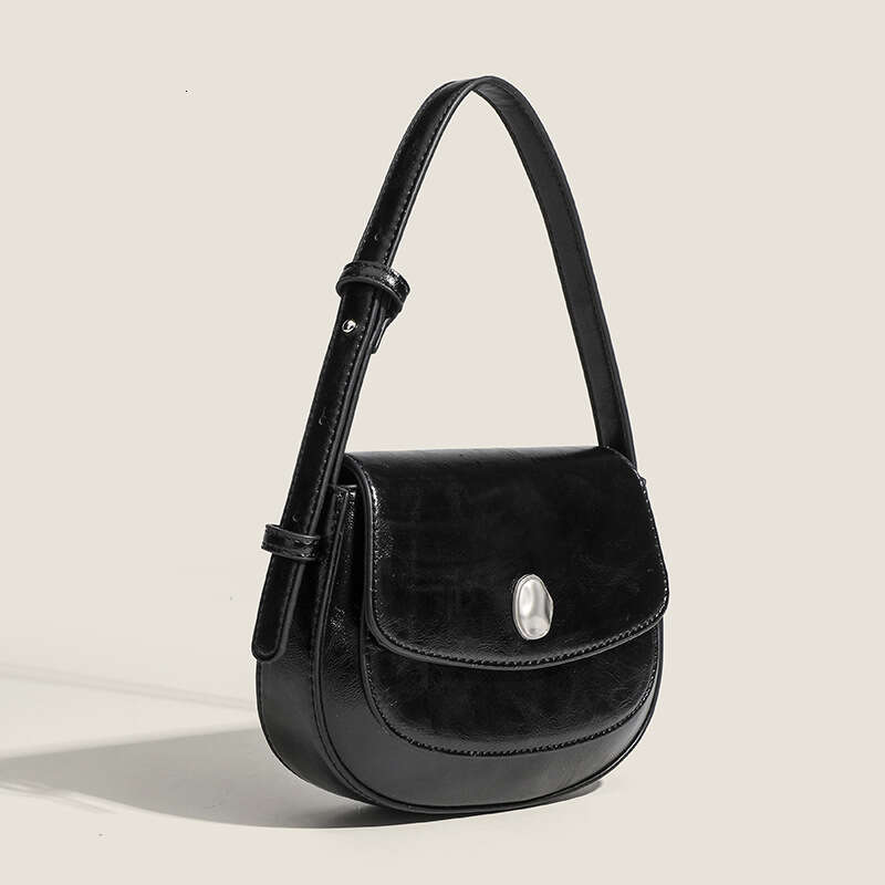 Korean Ins niche high-end semi-circular underarm with versatile temperament, saddle shoulder crossbody bag, hand-held bag