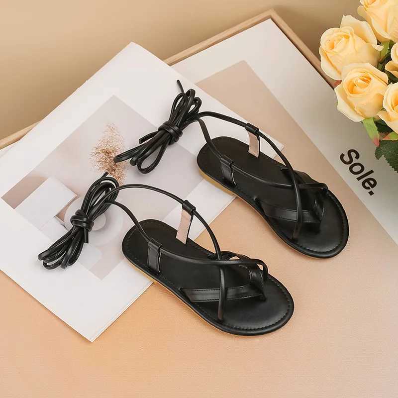 2024 New Womens Shoes Black Cross Belt Roman Sandals Summer Soft Bottom Comfortable Childrens Princess Shoes Flat Shoes Casual Flip Cover W250108