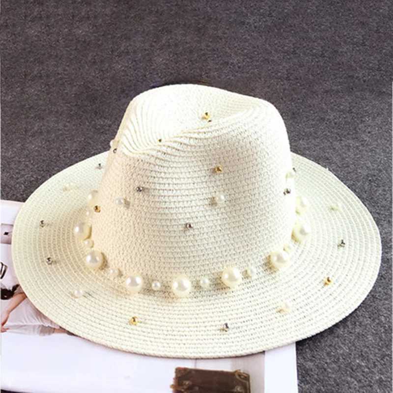 In the new summer of 2019 the UK pearl flat inlaid straw hat sun hat beach hat womens beach hat and sunny fashionable jazz hat X250109