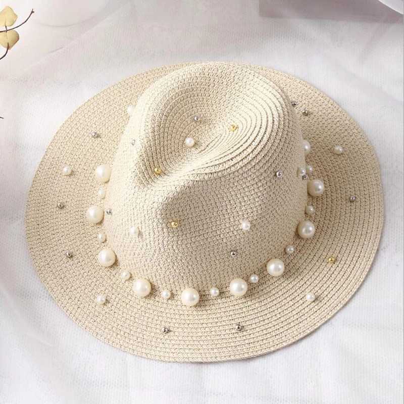 New spring and summer hats for floral beads wide edged jazz Panama hats sun shading beach hats pearl river grass hats X250109