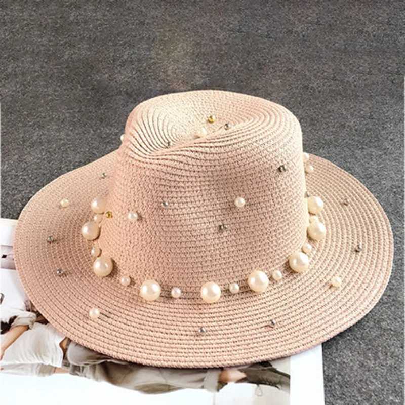 In the new summer of 2019 the UK pearl flat inlaid straw hat sun hat beach hat womens beach hat and sunny fashionable jazz hat X250109