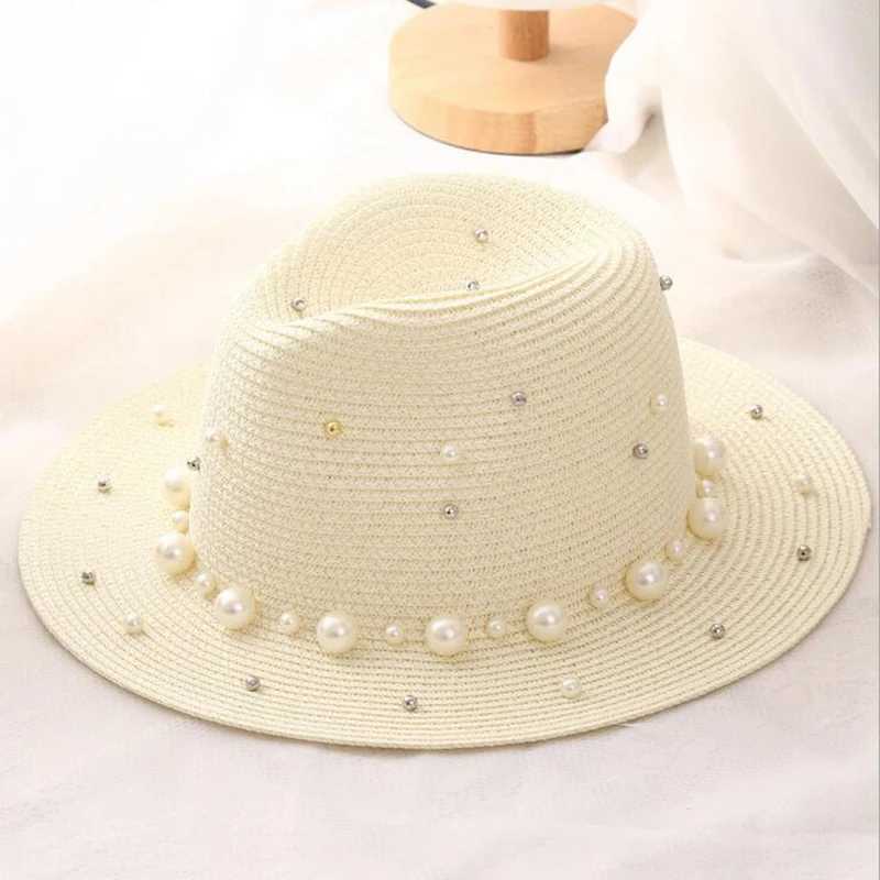 New spring and summer hats for floral beads wide edged jazz Panama hats sun shading beach hats pearl river grass hats X250109