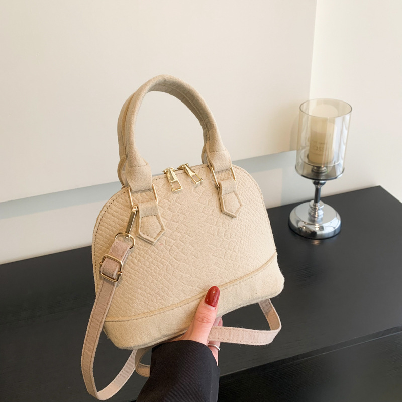 Baobao 2025 Spring New Korean Designer Handbag Fashion Handheld Shell Simple And Casual One Shoulder Crossbody Bag Female