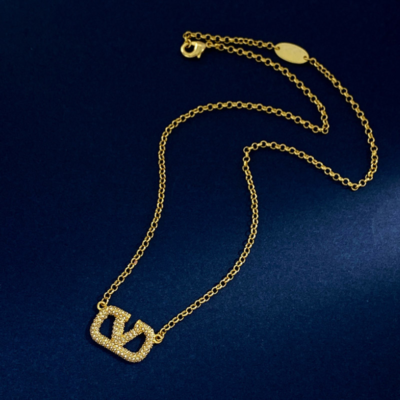 European and American fashion personality V letter titanium steel micro-inlaid zircon luxury silver needle earring necklace