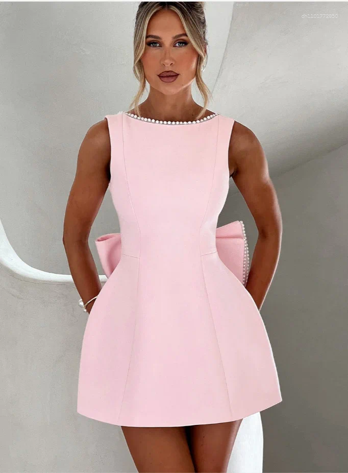 Elegant Backless Mini Dress: White Party Dress with Pearl Detail, Bow Accent & Corset Waist for Summer Beach or Wedding C260312