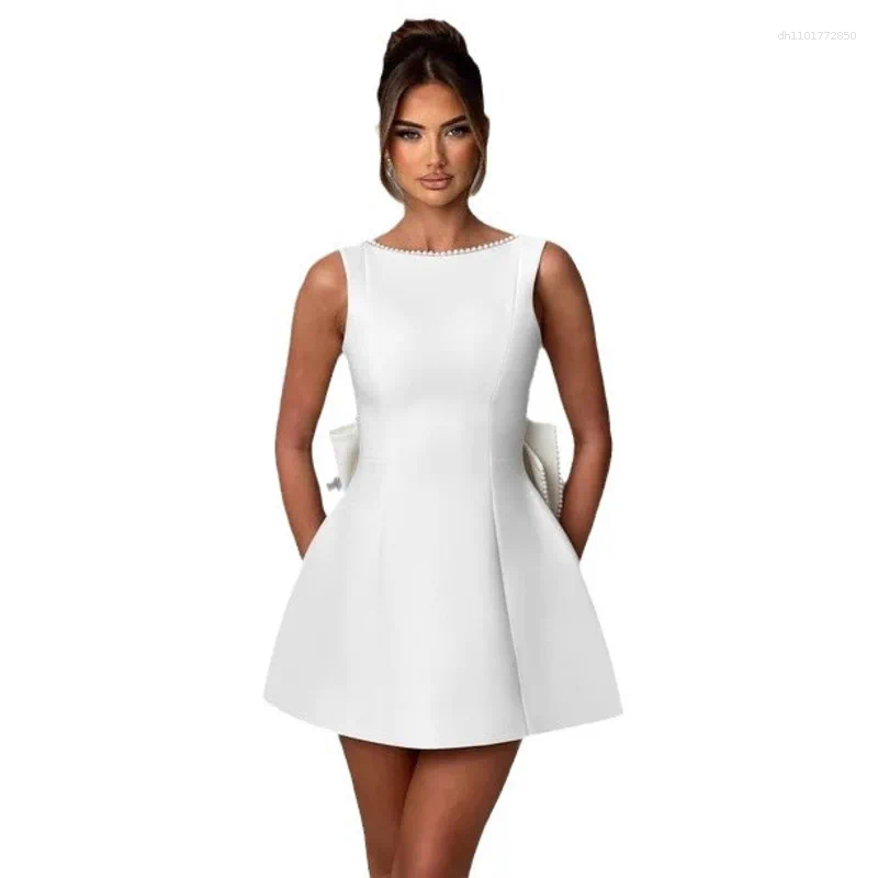 Elegant Backless Mini Dress: White Party Dress with Pearl Detail, Bow Accent & Corset Waist for Summer Beach or Wedding C260312