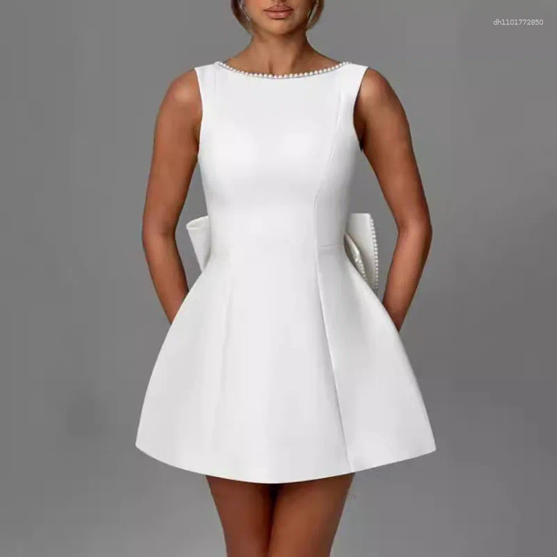 Elegant Backless Mini Dress: White Party Dress with Pearl Detail, Bow Accent & Corset Waist for Summer Beach or Wedding C260312