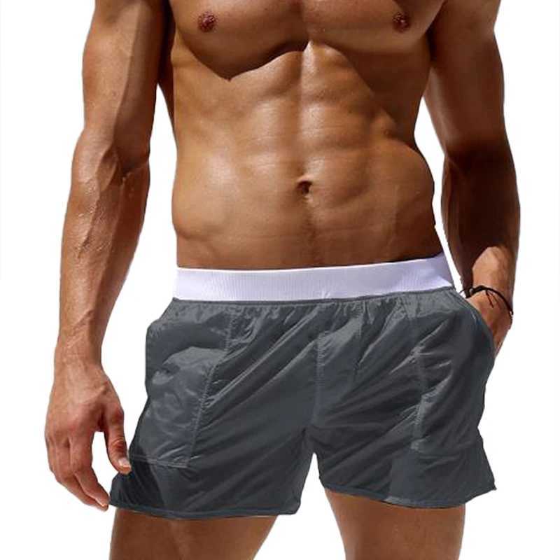 Mens solid swim trunks with elastic waist see through summer quick drying beach shorts low waist swimsuit with pockets W250114
