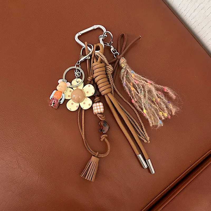 Keychains Lanyards Cell Phone Straps Charms Niche design feels like Maillard tassel pendant personalized and creative phone key bag chain H250217