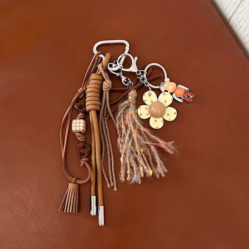 Keychains Lanyards Cell Phone Straps Charms Niche design feels like Maillard tassel pendant personalized and creative phone key bag chain H250217