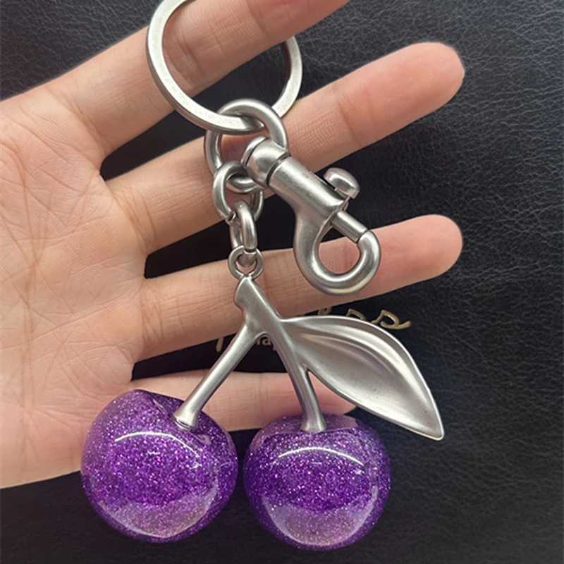 Keychains Lanyards Purple Cherry Charm Pendant Decoration For Handbag Shoulder Bag Womens High-Grade Keychain Bags Attachment Gift H250115