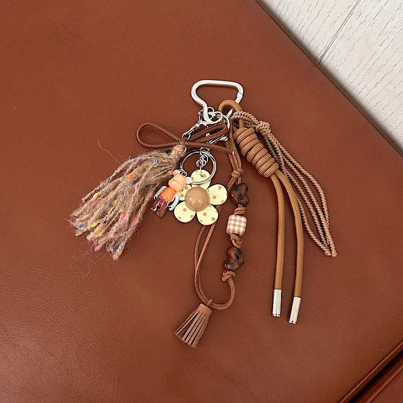 Keychains Lanyards Cell Phone Straps Charms Niche design feels like Maillard tassel pendant personalized and creative phone key bag chain H250217