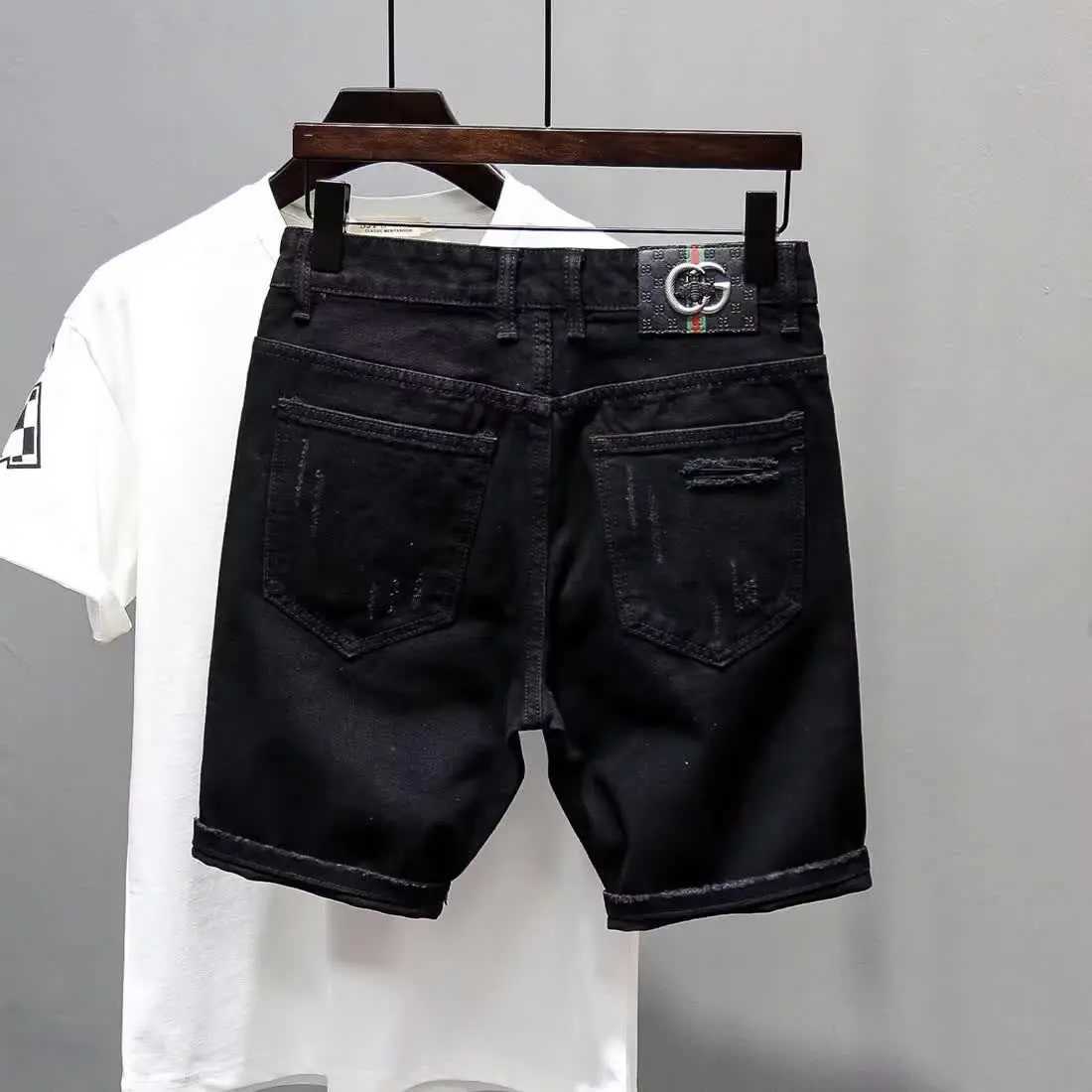 Summer casual mens denim shorts Korean straight wash jeans shorts torn cat whiskers ink splatter plain black five pants W250319