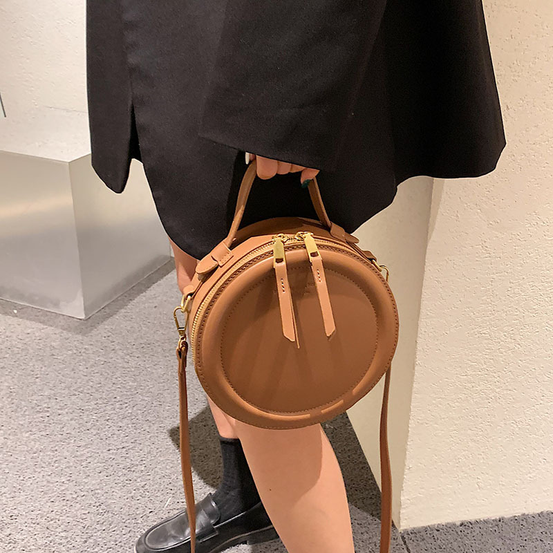 Europe and the United States new retro simple hand bill of lading shoulder small round bag crossbody bag for ladies ins trend bag wholesale