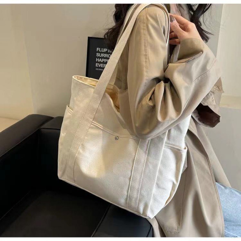 Simple commuter omnibus large capacity Tote canvas bag high appearance level art college students class shoulder cloth bag 2025