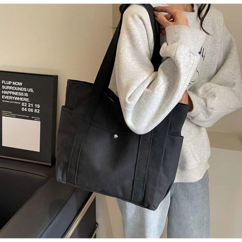 Simple commuter omnibus large capacity Tote canvas bag high appearance level art college students class shoulder cloth bag 2025
