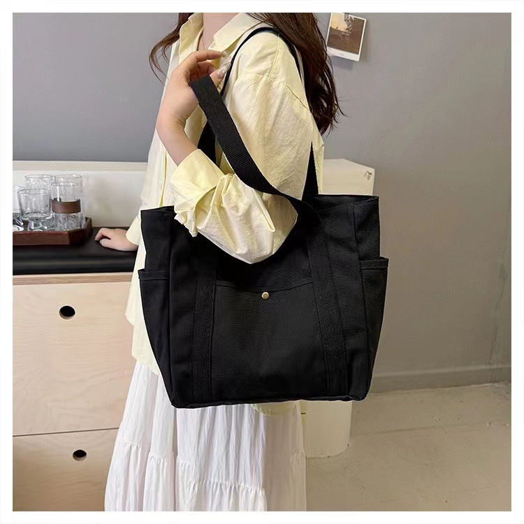 Simple commuter omnibus large capacity Tote canvas bag high appearance level art college students class shoulder cloth bag 2025