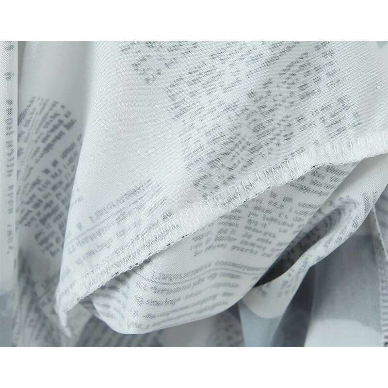 YENKYE New Women Newspaper Letter Print Irregular Hem Sg Dresses Fashion Backless Thin Straps With Chain Summer Sexy Dress
