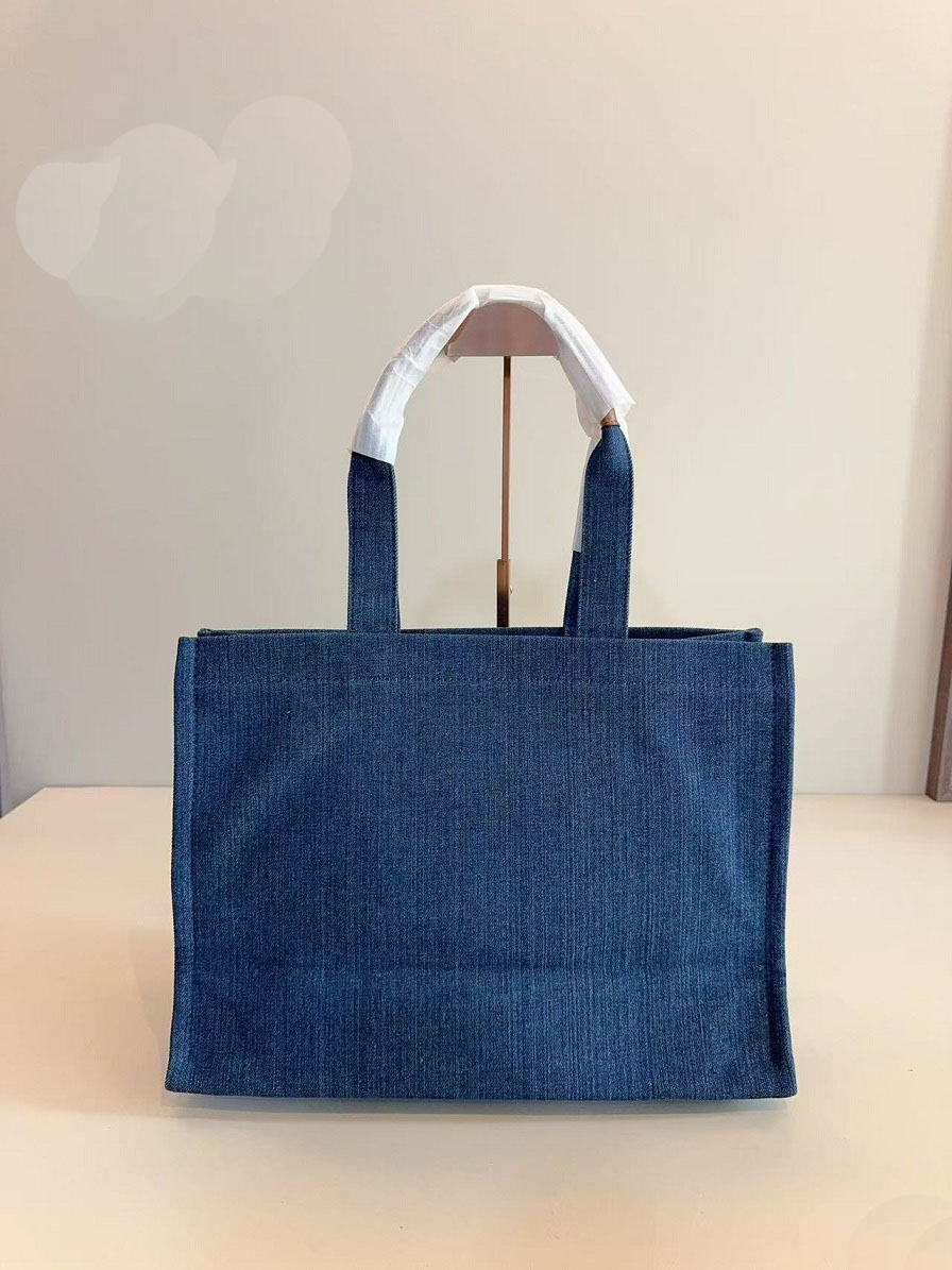 2025 Denim Blue Fashion Designer Shoulder Bags Beach Bags Shopping bags Tote bags All match store bags Large capacity and casual Brief caseGround leather