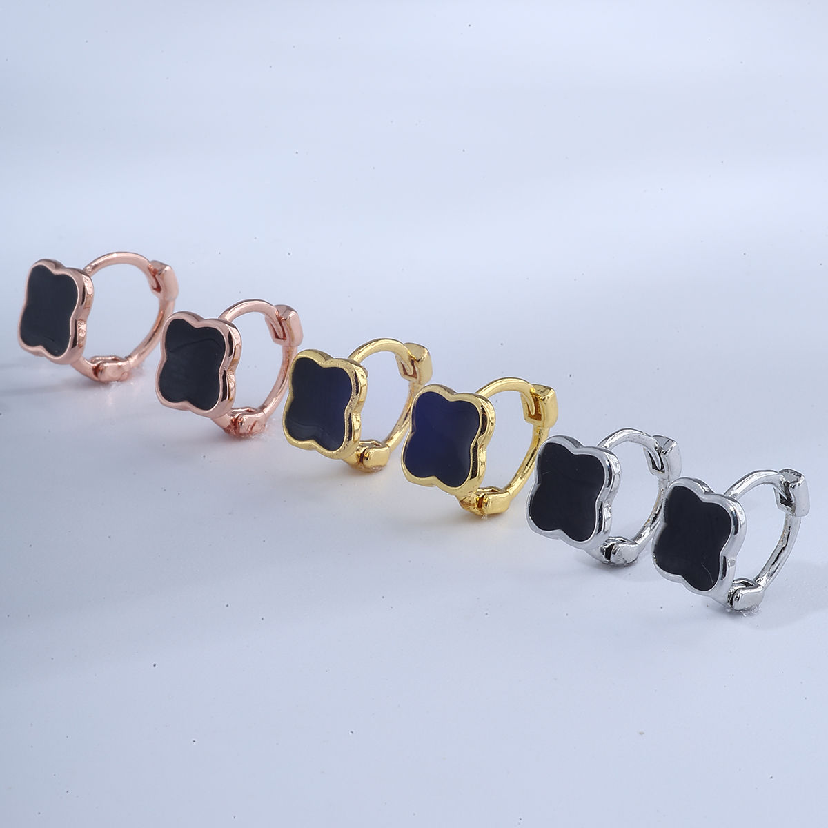 Cross border new copper inlaid zircon four leaf clover irregular earrings Fried Dough Twists earrings pierced jewelry