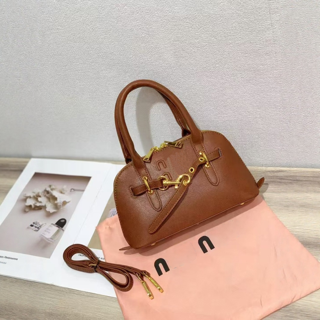 Designer bag Designer bucket bag fashion Trends top Luxury Bag makeup bag Shoulder Handbag Embossed Alphabet print pattern Evening bag Metal lock buckle Shell bag