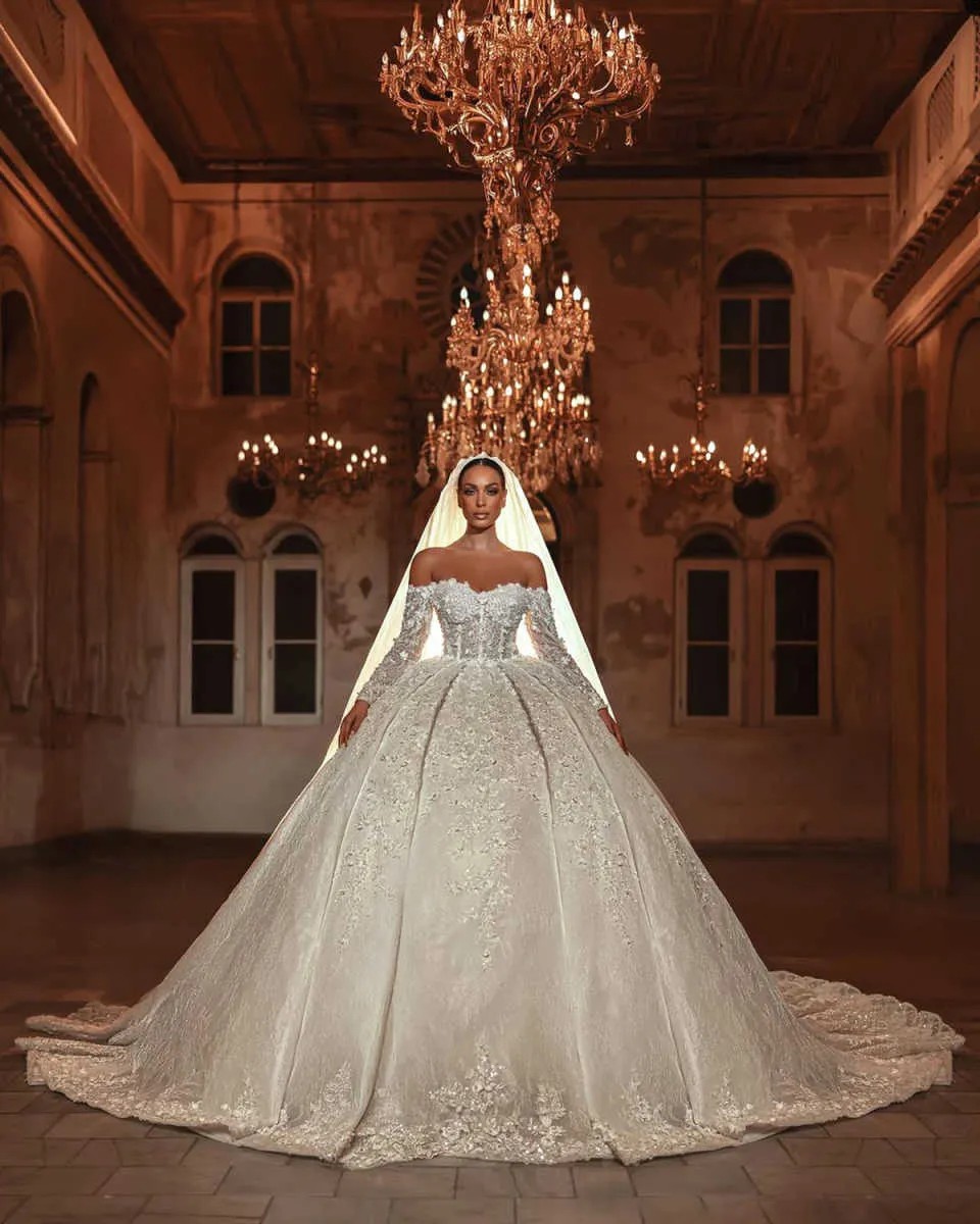 Luxury Lace Wedding Dress 2026 Long Sleeves Sequins Beads Dubai Sheer Neck Appliques Glitter Woman Elegant Bride Gowns Vestidos De Noiva