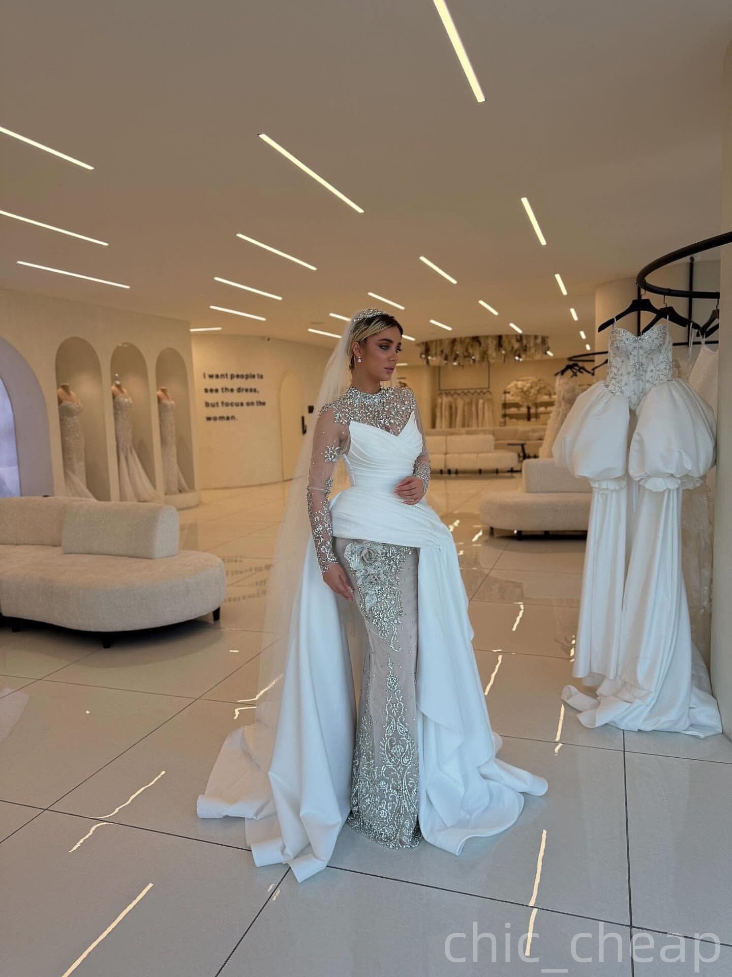 2025 Aso Ebi Plus Size Ivory Sheath Wedding Dress Crystals Lace Flower Satin Illusion Full Sleeves Vintage Bridal Gowns Dresses ZJ065